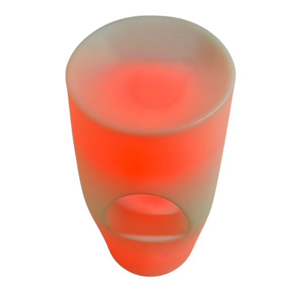 A sleek LED bar stool glows with vibrant, customizable lighting in a modern event setting, featuring a translucent polyethylene design, contoured seat, and cordless operation, perfect for weddings, parties, or corporate gatherings.